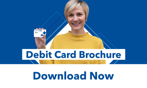 Decorah Bank employee Liz Roe holding up a Decorah Bank debit Card
